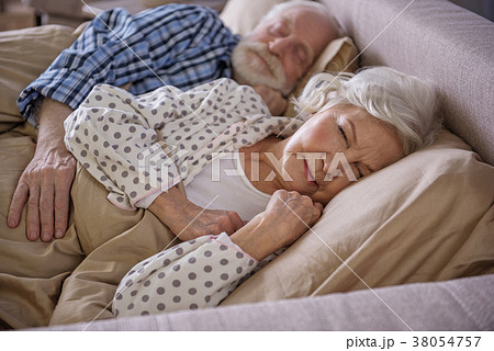 Calm senior man hugging mature woman 38054757