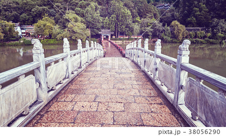 Bridge in the Jade Spring Park in Lijiang, China. Bridge in the Jade Spring Park in Lijiang, China. 38056290