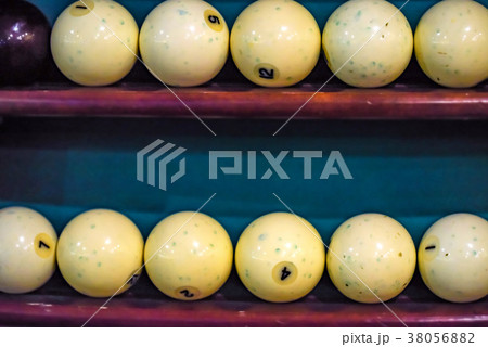 White billiard balls on shelf close White billiard balls on shelf close 38056882