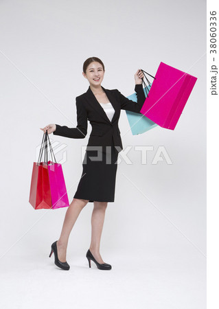 Everyday life of beautiful young woman, shopping, working concept photo in studio shot white background. 156 Everyday life of beautiful young woman, shopping, working concept photo in studio shot white background. 156 38060336
