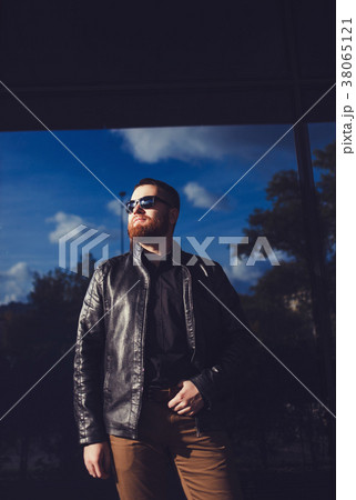 man dressed in black leather jacket man dressed in black leather jacket 38065121