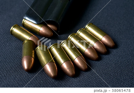 9 mm.bullets hand gun and loaded magazine. 38065478