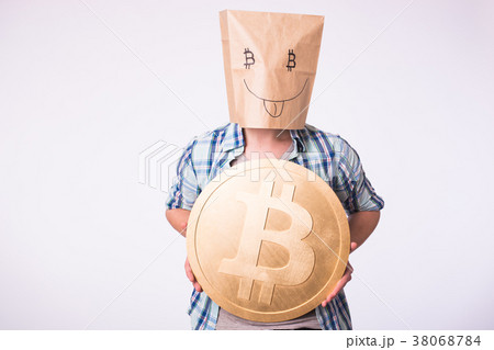 Golden Bitcoin in a funny man hand, Digitall 38068784