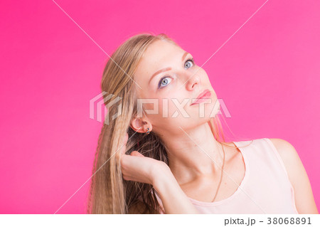 Fashion blonde over pink background. Woman 38068891