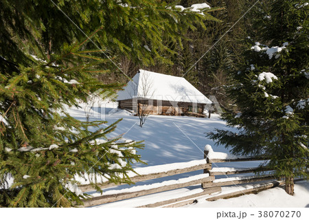 Old wooden house in the winter 38070270