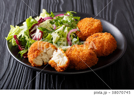 Homemade codfish cake and fresh salad Homemade codfish cake and fresh salad 38070745