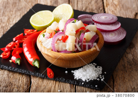 ceviche of white fish with ingredients close-up 38070800