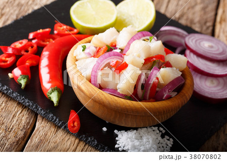 Snack ceviche of white fish with onion and pepper 38070802
