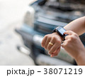 Woman touching hand smart watch, call emergency ca 38071219