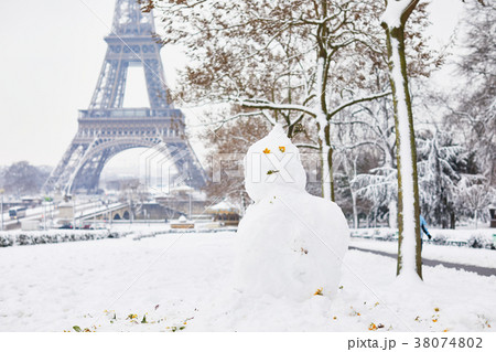 Snowman and Eiffel tower on a day with heavy snow 38074802