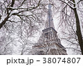 Eiffel tower on a day with heavy snow 38074807