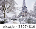 Eiffel tower on a day with heavy snow 38074810