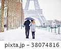Couple of tourists in Paris on a day with snow 38074816