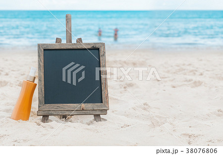 Chalk board sunscreen cream sand on beach tropic 38076806