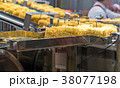 Instant noodles on transmission belt in production 38077198