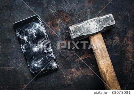 Big modern smartphone with broken screen debris Big modern smartphone with broken screen debris 38078081