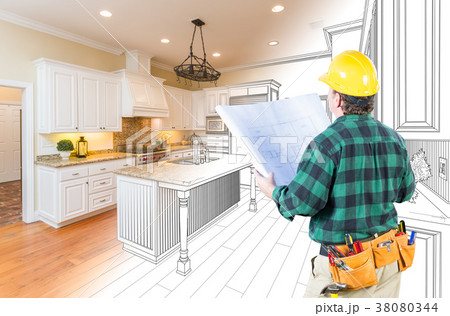 Male Contractor with Hard Hat and Plans Looking At Custom Kitche 38080344