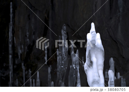 ice stalagmites in the cave 38080705