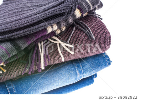 Jeans, pullover, scarf and hat on white background 38082922
