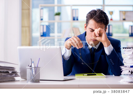 Tired businessman exhausted after hard work and 38083847