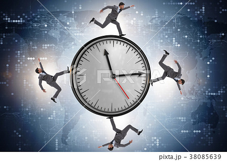Businessman in time management concept Businessman in time management concept 38085639
