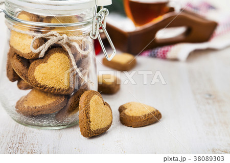 Heart-shaped cookies in a glass jar 38089303