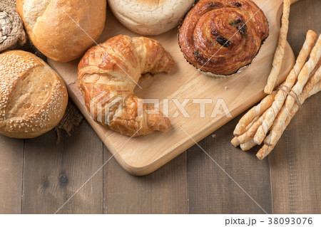 Homemade croissant and bread on old wood Homemade croissant and bread on old wood 38093076