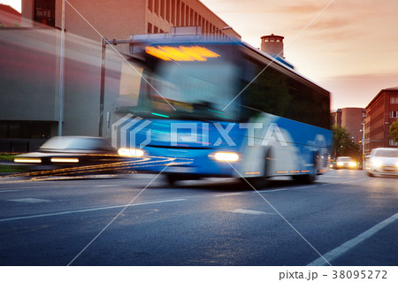 Bus moving on the road in city in early morning 38095272