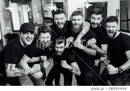 Professional hairstylists in barbershop interior 38095444