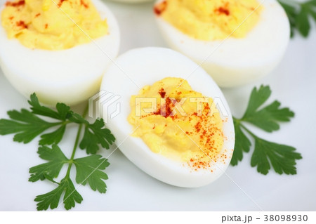 Deviled eggs filled with delicious blend  38098930