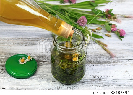 Herbal organic oil made from herbs and olive oil Herbal organic oil made from herbs and olive oil 38102394