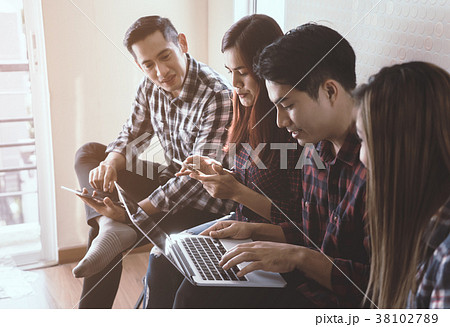 Casual worker sitting in a row in team meeting Casual worker sitting in a row in team meeting 38102789