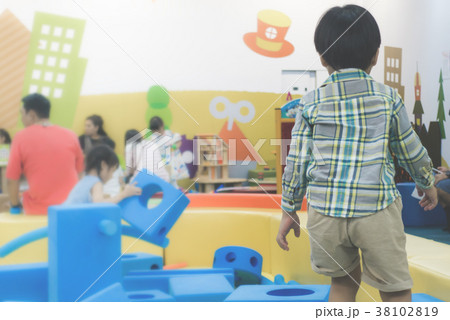 Back of a Boy is playing indoor playground Back of a Boy is playing indoor playground 38102819