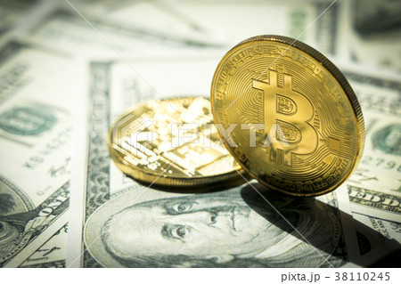 Close-up Bitcoins on dollar banknote;Crytocurrency 38110245