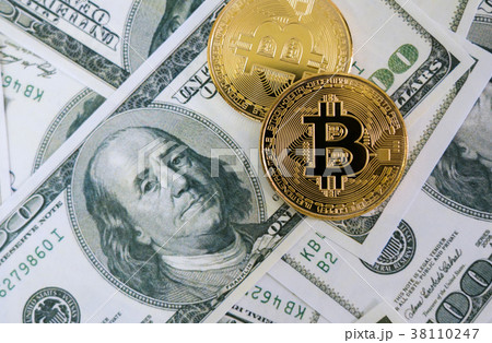 Top view of Bitcoin on Dollar banknote (Fintech) 38110247