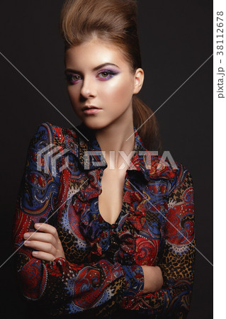 Portrait of beautiful young girl with glamorous evening makeup Portrait of beautiful young girl with glamorous evening makeup 38112678