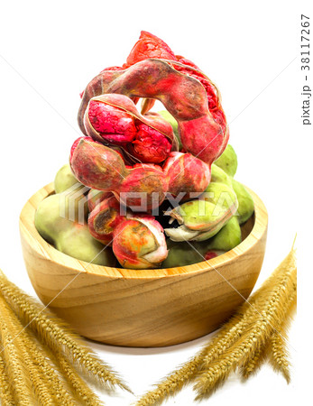 Closeup Manila tamarind on wood cup with dry grass 38117267