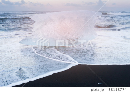 Breaking Ice on black sand beach, Iceland 38118774