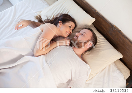 a man and a woman sleeping in beds at home a man and a woman sleeping in beds at home 38119533