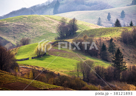 Green hills in mountain valley. Spring landscape. Green hills in mountain valley. Spring landscape. 38121893