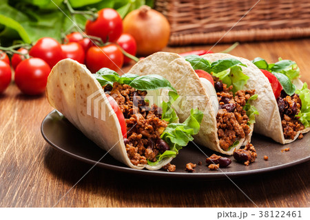 Mexican tacos with minced meat, beans and spices Mexican tacos with minced meat, beans and spices 38122461