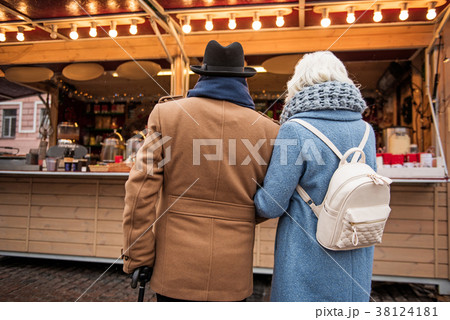 Old man and woman want purchase in store outdoor 38124181