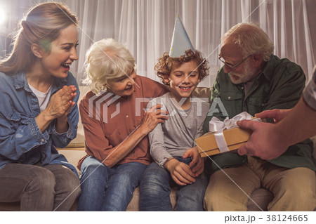 Cheerful family celebrating birthday of son 38124665