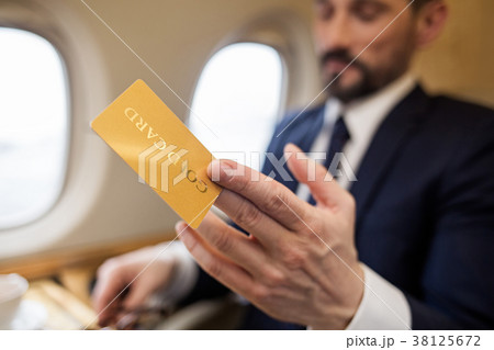 Calm imposing man paying for service Calm imposing man paying for service 38125672