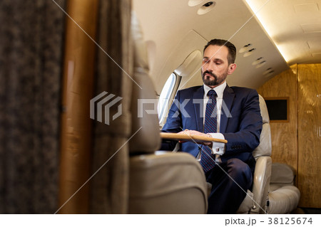 Serene gentleman using private jet Serene gentleman using private jet 38125674