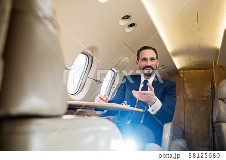 Cheerful male using air transport 38125680