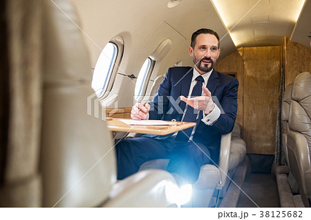 Pleased mature man having business trip Pleased mature man having business trip 38125682