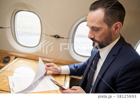 Imposing mature man on business trip Imposing mature man on business trip 38125693