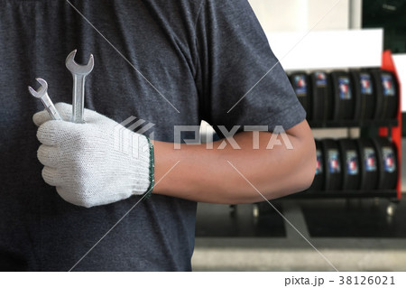 Mechanic repairing a car in garage Auto repair Mechanic repairing a car in garage Auto repair 38126021