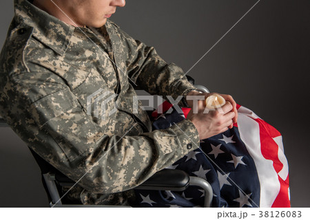 Disabled male soldier holding suppository Disabled male soldier holding suppository 38126083